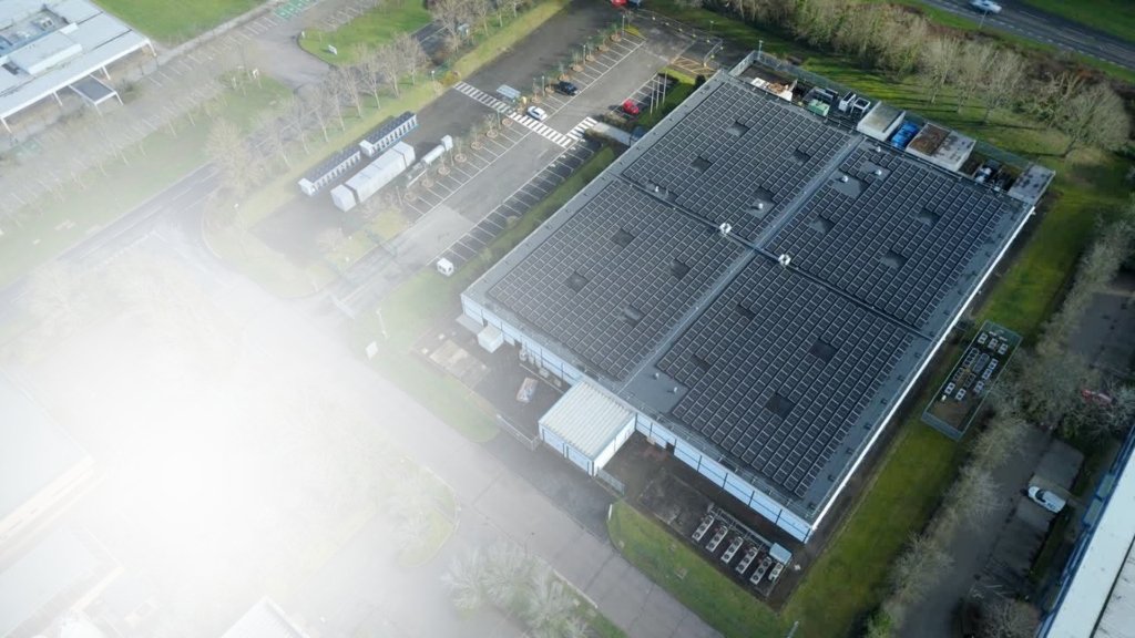 Aerial view of commercial rooftop solar panel array